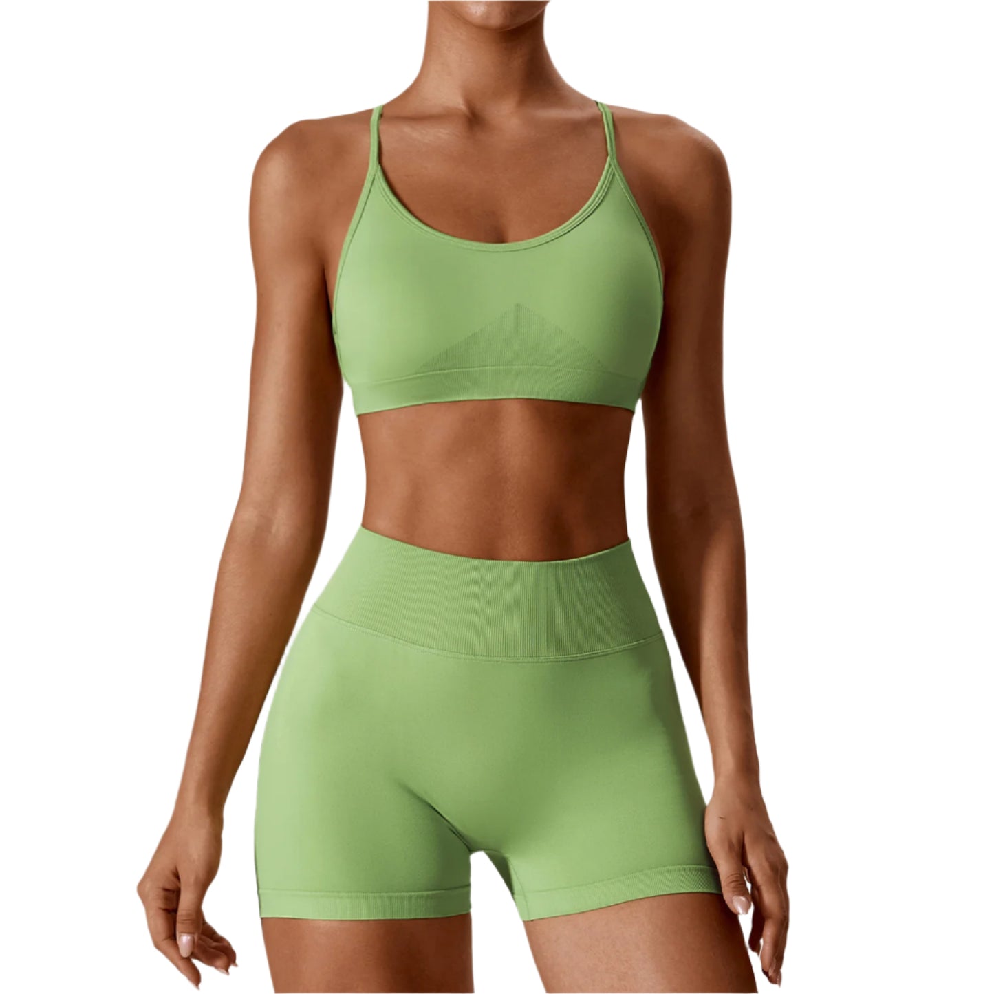 A set of yoga fitness clothes in green, including a sleeveless sports bra and abdominal-length shorts.