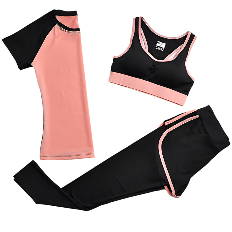 A set of yoga clothes consisting of a sports bra, a t-shirt, and leggings. The sports bra has orange straps and a black center, the t-shirt is primarily orange with black sleeves, and the leggings are black with orange accents.