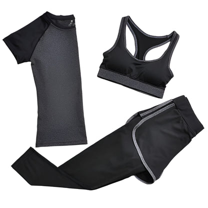 A set of yoga clothes consisting of a sports bra, a t-shirt, and leggings. The sports bra has gray straps and a black enter, the t-shirt is primarily gray with black sleeves, and the leggings are black with gray accents.