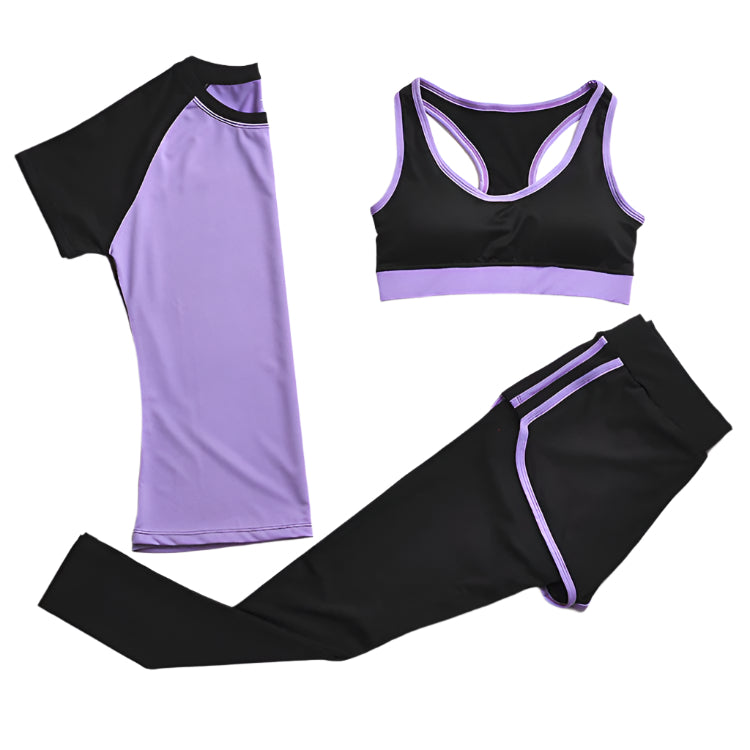 A set of yoga clothes consisting of a sports bra, a t-shirt, and leggings. The sports bra has purple strap and a black center, the t-shirt is primarily purple with black sleeves, and the leggings are black with purple accents.