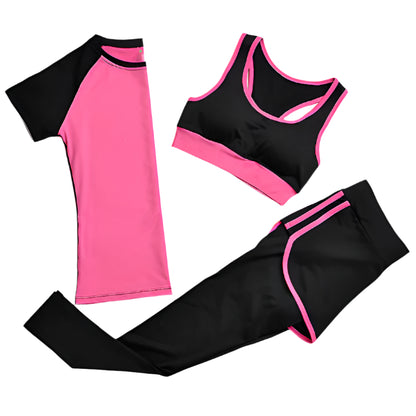 Black and pink athletic outfit with tank top, leggings, and long-sleeve shirt on a white background