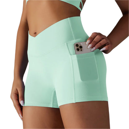 A collage of images displaying yoga shorts with a phone pocket in various solid colors worn by a model.