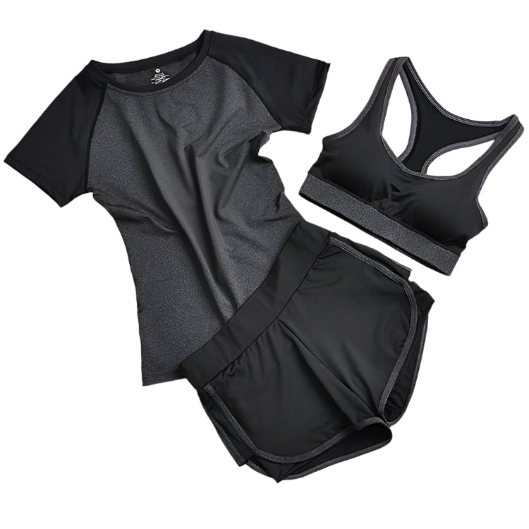 A set of yoga clothes consisting of a sports bra, a t-shirt, and leggings. The sports bra has a gray straps and a black center, the t-shirt is primarily gray with black sleeves, and the leggings are black with gray accents.