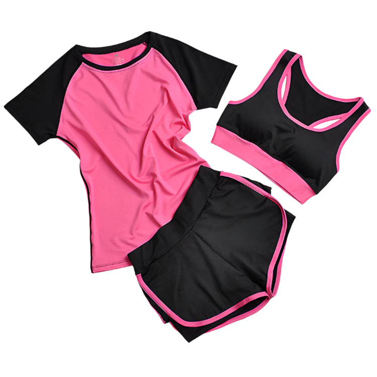 A set of yoga clothes consisting of a sports bra, a t-shirt, and leggings. The sports bra has pink straps and a black center, the t-shirt is primarily pink with black sleeves, and the leggings are black with pink accents.